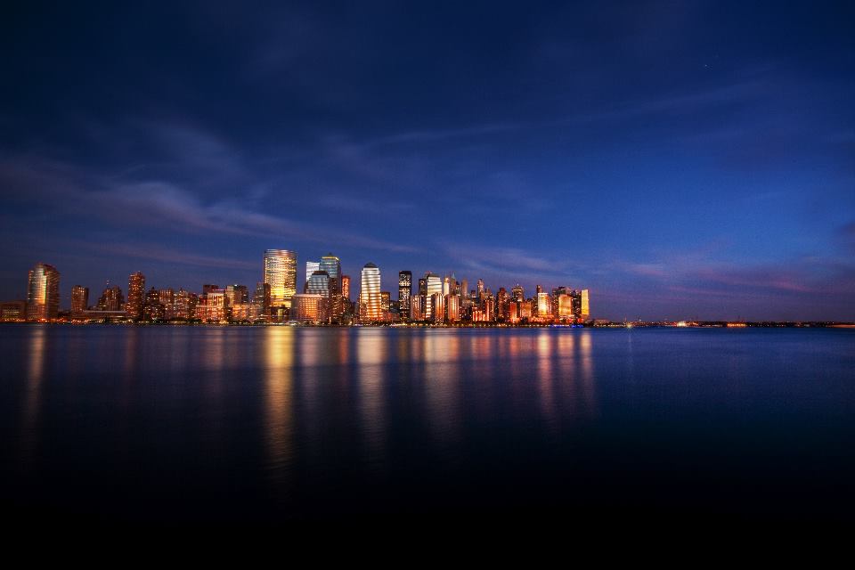 Manhattan skyline at dusk, seen across the Hudson River